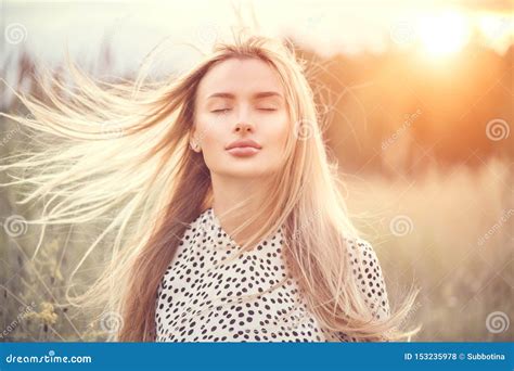 Portrait Of Beauty Girl With Fluttering White Hair Enjoying Nature Outdoors Flying Blonde Hair