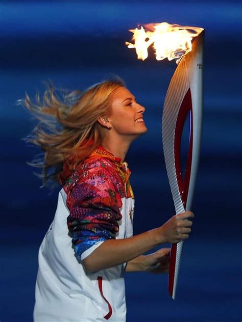 Maria Sharapova Carries Olympic Torch Into Stadium During 2014 Sochi Opening Ceremony Fairways