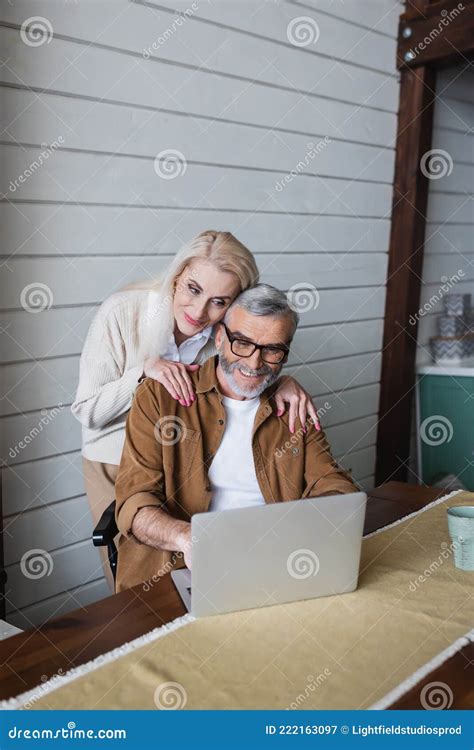 Senior Woman Hugging Smiling Husband In Stock Image Image Of Cheerful