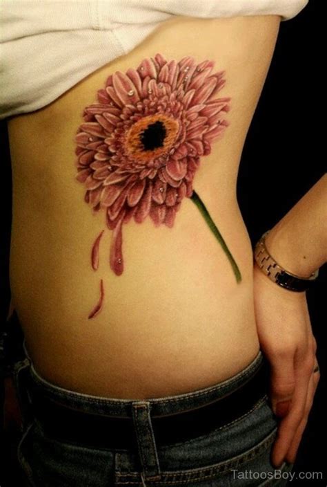 Delightful Daisy Tattoo Flower Tattoo On Rib Tattoo Designs Tattoo