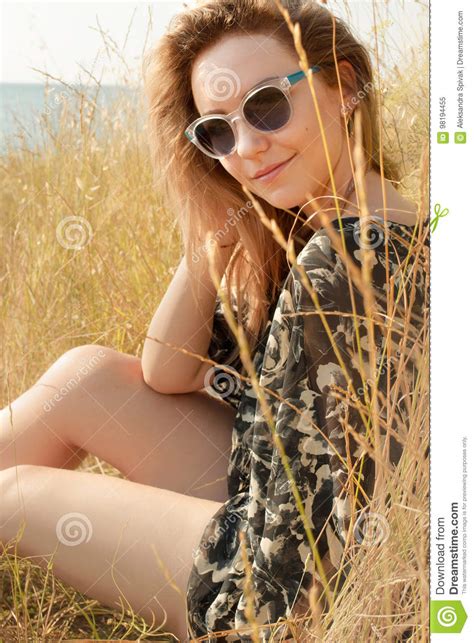 Pretty Blond Girl Relaxing On Field With Dry Grass Stock Image Image
