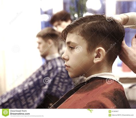 Boy Has His Hair Cut In Barber Shop Men Room Editorial Photography