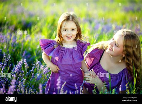 Beautiful Young Mother And Her Daughter Having Fun At The Lavender