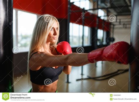 Beautiful Blonde Woman Wearing Boxing Gloves Royalty Free