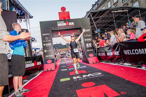 Discussion of im races, training, and professional triathletes. Ironman-copenhagen,-woman-at-finish-line-running ...