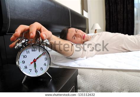 Man Sleeping Alarm Clock Front Stock Photo Edit Now 131112632