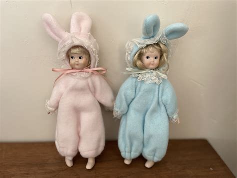 two 1960s vintage small dolls dressed as bunnies pink and blue easter decorations vintage
