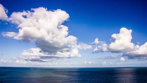 Download 2560x1440 Wallpaper White Clouds Sky Blue Sea Nature Dual
