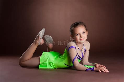 Young Teen Girl In Green Gymnast Costume Posing Stock