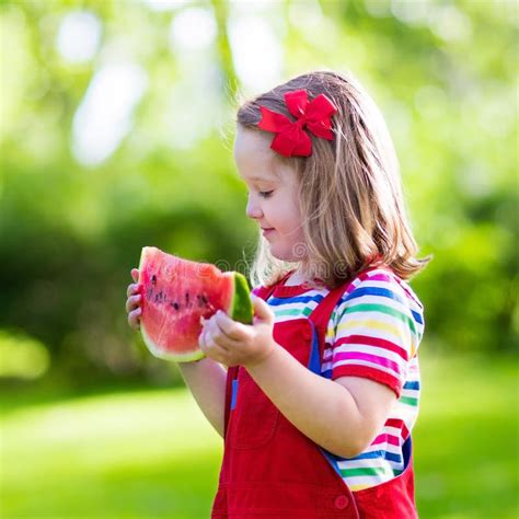 Little Girl Eating Watermelon In The Garden Stock Image Image Of