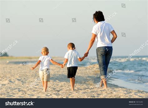Three People Walking On Beach Stock Photo 16816285 Shutterstock