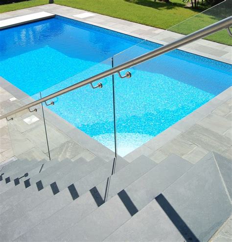 A Stunning Outdoor Private Swimming Pool Set In A Garden With Slate