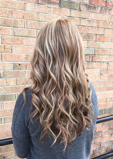 Loving this color combo by our stylist cel! The fall blonde is a blend of natural blonde/ cool brown ...