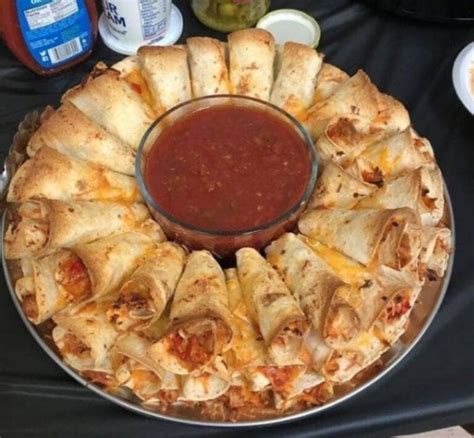The tortillas are filled with seasoned shredded chicken and cheese. Blooming Quesadilla Ring - Recipe Ketchup