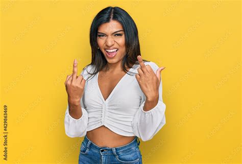 Young Latin Transsexual Transgender Woman Wearing Casual Clothes Showing Middle Finger Doing