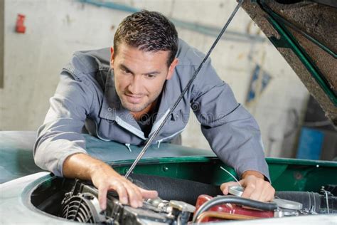 Mechanic Working In Engine Bay Stock Photo Image Of Support