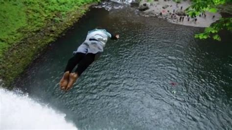 Guy Jumps On Friend In Waterfall Pond Jukin Media Inc