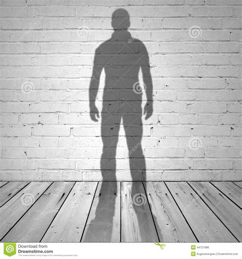 Shadow Of A Man On White Brick Wall Stock Photo Image 44721986