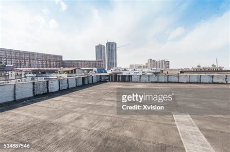 Asphalt Platform In Top Of A Building With Fuzhou City At Background