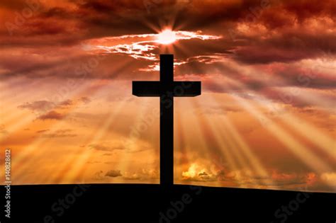 Jesus Christ Wooden Cross On A Scene With Dark Red Orange Sunset