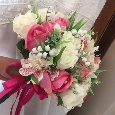 A Wedding Bouquet Of Artificial Roses Astromeria And Lily Of The Valley
