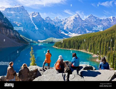 Tourists Looking At Moraine Lake In The Valley Of The Ten Peaks Banff