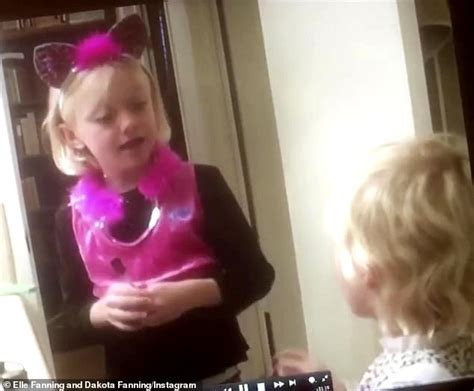Elle Fanning Playfully Spars With Big Sister Dakota In Adorable Halloween Video From Their