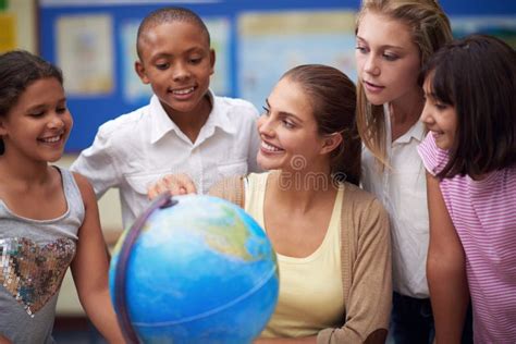 Its A Big World A Teacher Teaching Her Students About The Globe In A