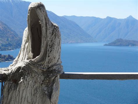 An Ominous Figure Sitting Near The Cliff Side At Lake Como Italy Oc