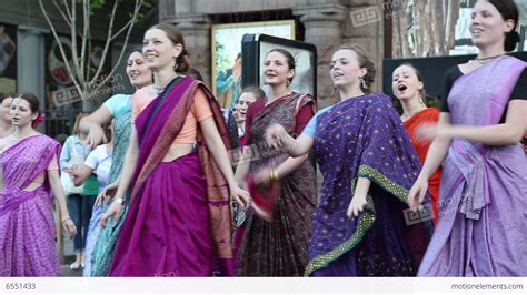 Women In Hindu Traditional Costumes Dancing And Singing Hare Krishna