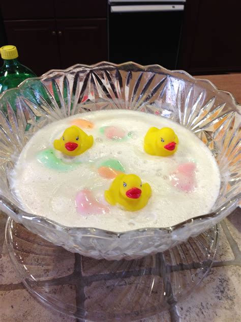 Some serve blue punch for boy showers, and others serve whatever tastes good. Duckies in punch bowl for baby shower | Event design, Food ...