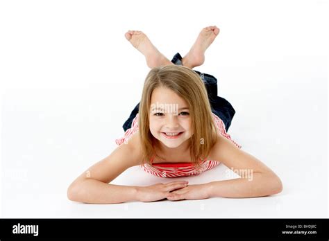 Young Girl Lying On Stomach In Studio Stock Photo Alamy