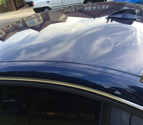 See below for completed repair of this car dents to this panel are nearly always glue pulled out. Dent on my E90 roof!