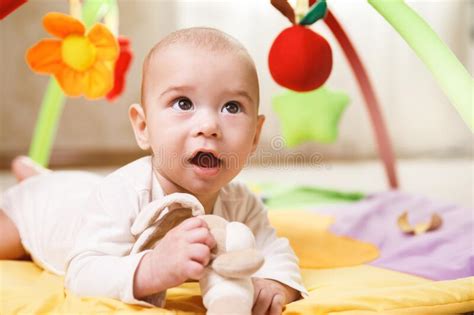 Cute Baby Is Playing On The Activity Mat Stock Image Image Of