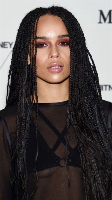 Kravitz can be seen accessorizing with embellishments like hair jewelry and playing with color, which spices up this hairstyle even more. Zoe Kravitz | Bangs with medium hair, Zoe kravitz braids