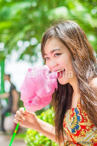 Cute Thai Girl Is Eating Pink Candyfloss With Joy Candyfloss Body