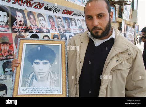 Benghazi Libya A 30 Year Old Man Shows A Portrait Of His Missing