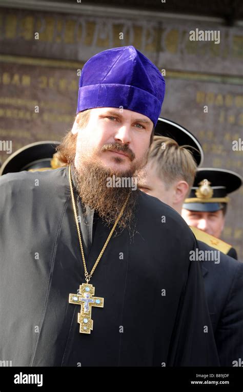 Portrait Of A Priest From The Russian Orthodox Church With His Big Cross Around The Neck In