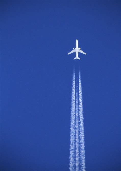 Flying in the sky, rocca massima. White plane, blue sky | A plane seen flying over Devon in ...
