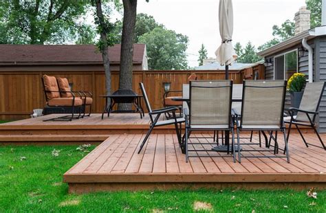 Vintage wood chair on outdoor wooden terrace. How to Build a Floating Wood Patio Deck | Hunker