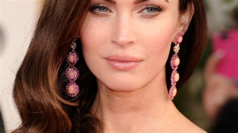 megan fox looks nearly unrecognizable in curly blonde wig