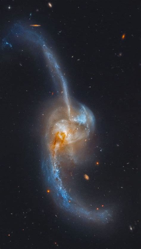 It is considered a grand design spiral galaxy and is classified as sb (s)b, meaning that the galaxy's arms wind moderately (neither tightly nor loosely) around the prominent central bar. False-color HST image of peculiar spiral galaxy NGC 2623, also known as Arp 243; about 260 mly ...