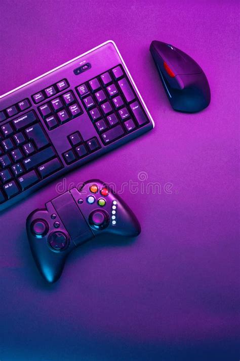 Keyboard Mouse And Joystick On Violet Table Background Stock Image