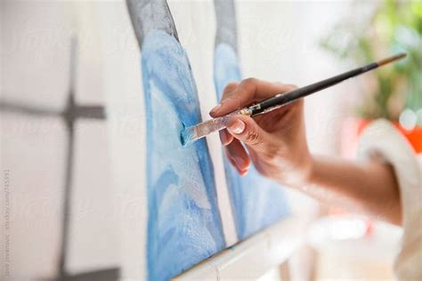Artist Paints A Picture With Oil Paint Brush In Hand By Stocksy Contributor Jovo Jovanovic