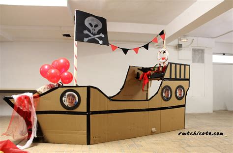 A Cardboard Pirate Ship With Balloons And Streamers