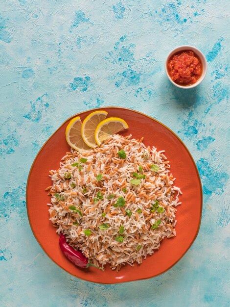 Premium Photo Turkish Rice Pilaf With Orzo In A Plate Top View