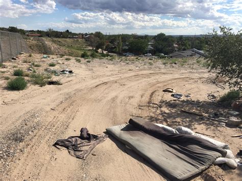 Albuquerque neighborhood inundated with trash dumped on NMDOT land