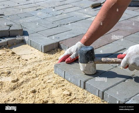 Laying Paving Stones On A Sand Bed Stock Photo Alamy