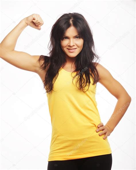 Young Sporty Woman Flexing Her Biceps Stock Photo By ©juiceteam 34558491