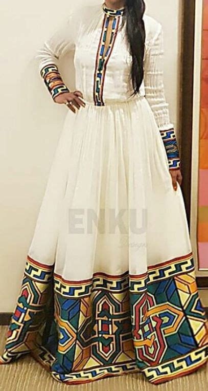 A marital dress, typically all white and decorated with frills and veils. Enku design | Ethiopian clothing, Ethiopian dress ...